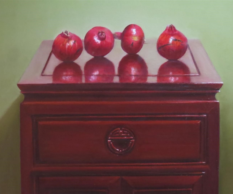 Pomegranates on rosewood 